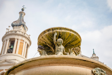 Obraz premium Fountain next to Loreto Basilica della Santa Casa in sunny day in Italy