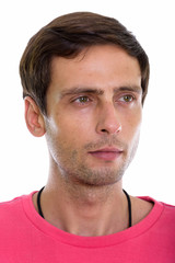 Fototapeta premium Face of young handsome man thinking while looking at distance 