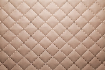 Patterned brown leather fabric background or texture