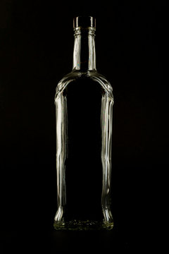 Silhouette of a bottle of alcohol on a black background
