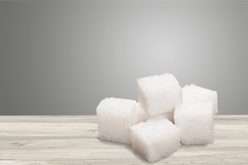 Cubes of sugar on white background