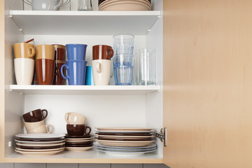 kitchen cabinet or cupboard for dishes with copy space