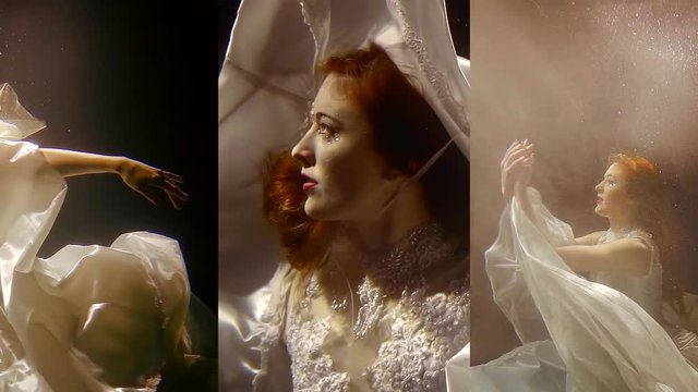 Vertical video of a pretty girl with red hair under water in a white dress, as in a fairy tale mermaid swims under water