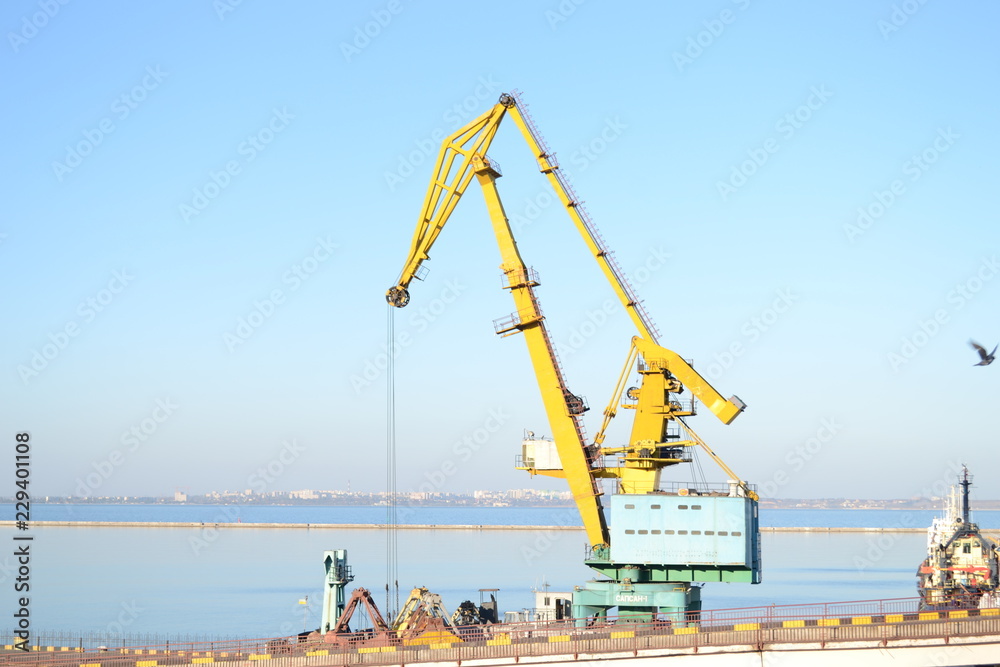 Wall mural yellow crane in port