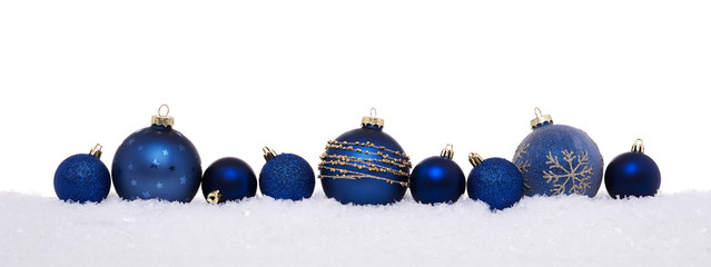 Blue christmas balls isolated on snow, Christmas decoration
