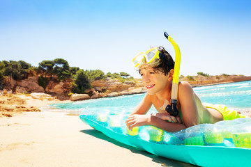 Young diver spending summer vacation on the beach