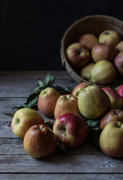 Apples and leaves near basket
