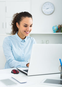 Adult woman working at laptop