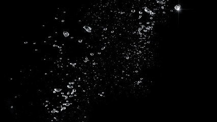 Blurred images of close-up soda water bubbles fizzing up or splashing or sparkling like a exploding...