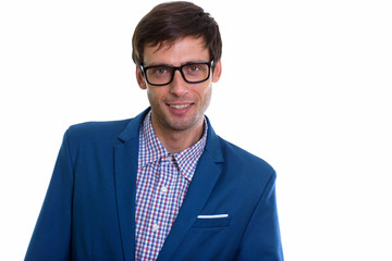Studio shot of young happy businessman  smiling with eyeglasses