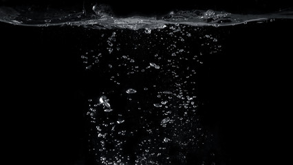 Blurred images of close-up soda water bubbles fizzing up or splashing or sparkling like a exploding of a bomb on black background for represent refreshing from carbonated drinks menu. - obrazy, fototapety, plakaty
