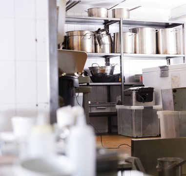 Rack With Pans In Restaurant Kitchen