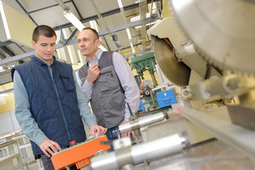 teacher with student in metallurgy workshop