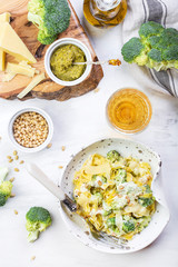 homemade pumpkin paste tagliatelle with broccoli and pesto
