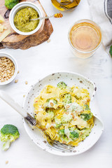 homemade pumpkin paste tagliatelle with broccoli and pesto
