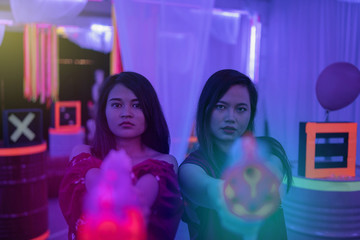 asian teenage playing laser tag indoor