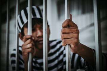 Hands of men desperate to catch the iron prison,prisoner concept,thailand people,Hope to be free.