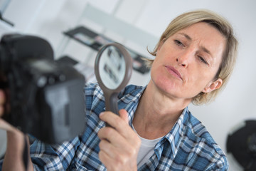 technician examining and repairing dslr camera