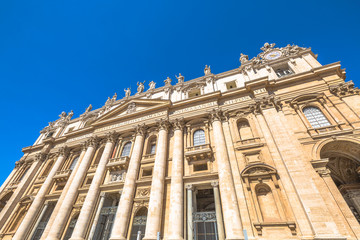 Fototapeta na wymiar Rome, Italy - June 18, 2016: Close up of facade of Basilica di San Pietro, Vatican City in Rome, Italy.