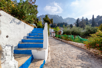 Street in the center of the mountain village Zia on the island of Kos, a beautiful landscape, a...
