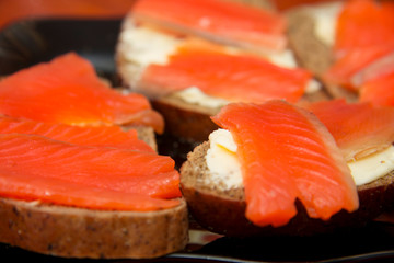 Fresh salmon sandwich with salted salmon and butter and dark bread