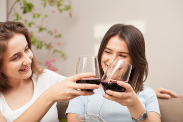 two woman chatting at home