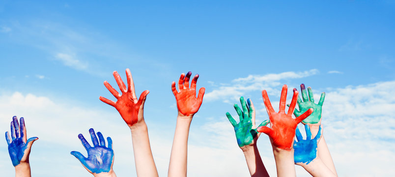Happy children painted hands