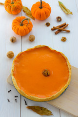 American pumpkin pie on a wooden table