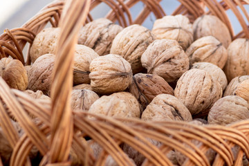 Walnuts lie in a wicker basket. Useful and delicious food
