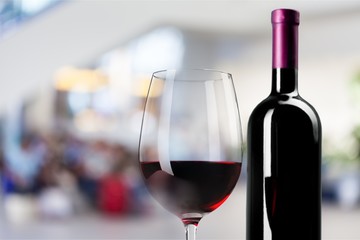 Red wine glass and bootle with shadow