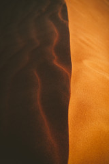Sand dune in the desert at sunset