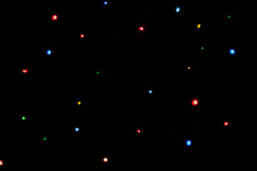 multicolored lights blurred bokeh on dark background
