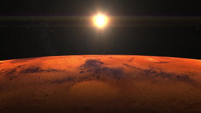 Planet Mars from space. Stars twinkle. Flight over the Mars. 4K. Sunrise. The Planet Mars slowly rotates. The sun is in the frame. The camera moves forward.