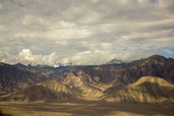 beautiful sky over the desert snow capped mountains