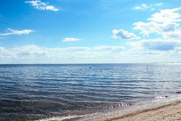 Summer sea waves and sky in the clouds