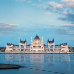 Parliament building in Budapest, Hungary. Building facade with reflection in water. Beautiful picture at sunset
