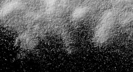 White crystal sugar pile isolated on black background and texture, top view