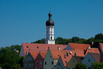 Red tiled roof houses and Maria Himmelfahrt Church tower. Landsberg am Lech, Germany