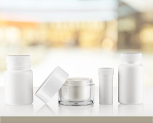 Cosmetic containers isolated on background