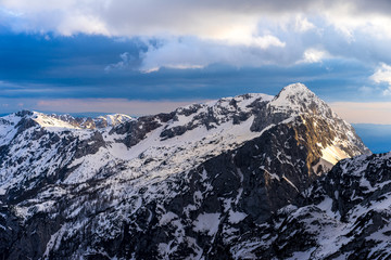 Winter alpine mountain landscape of Kamnik-Savinja Alps, Slovenia. Sunset or sunrise in high...