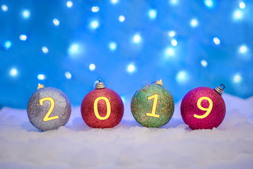 Christmas balls in the snow with 2019 new year