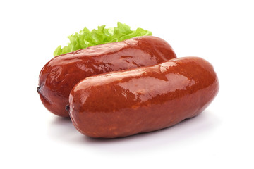 Oktoberfest Grilled Sausages with lettuce. Isolated on a white background. Close-up
