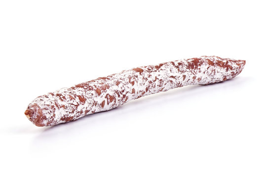 Spanish Fuet thin dried sausage, Close-up, isolated on a white background.