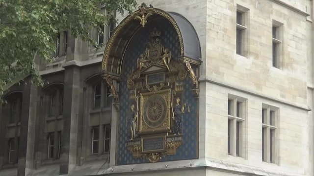 An ancient clock with gold details, Paris, France