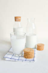 Milk in bottles on white background, kitchen