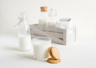 Milk in bottles on white background, kitchen