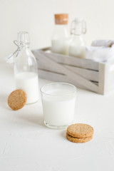 Milk in bottles on white background, kitchen
