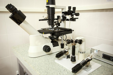 The equipment in the laboratory of the clinic of in vitro fertilization IVF. Microscope, tubes, nitrogen, other devices for chemical manipulations in the laboratory