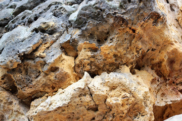 Geological layers of earth - Layered rock background. rock layer sediment. Layer of yellow sand. Crust of the Earth. Strata, slate or shale rock layers.