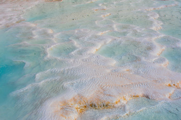 Sunny day in Pamukkale. Amazing white travertine, dry pool in Pamukkale, geological phenomenon, literally 
